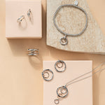 Ripples Silver Four-Hoop Pendant with Topaz